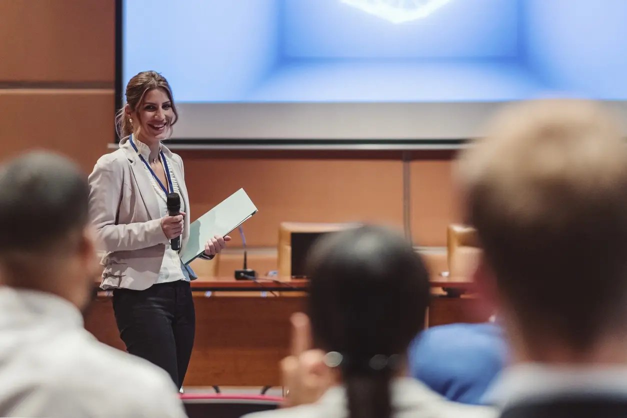 Woman presenting in auditorium