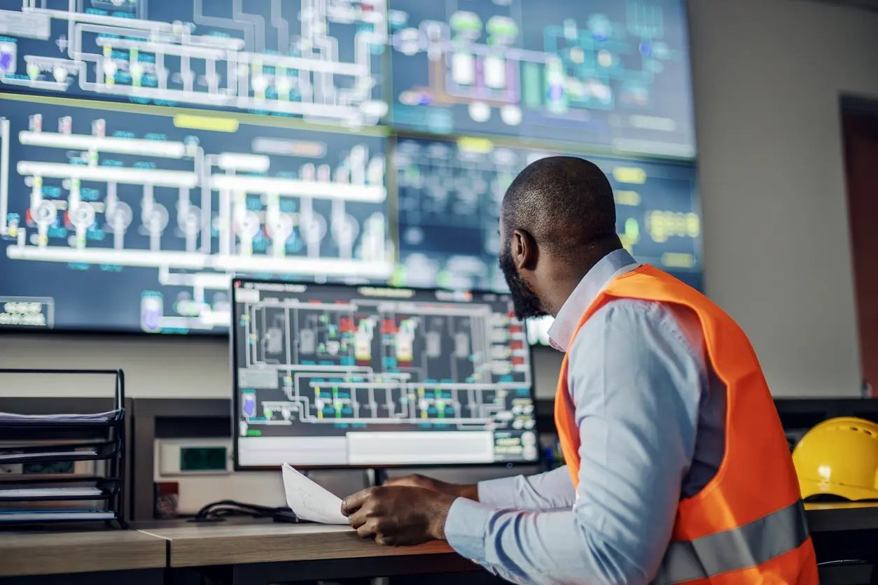 Engineer views screen in command and control center