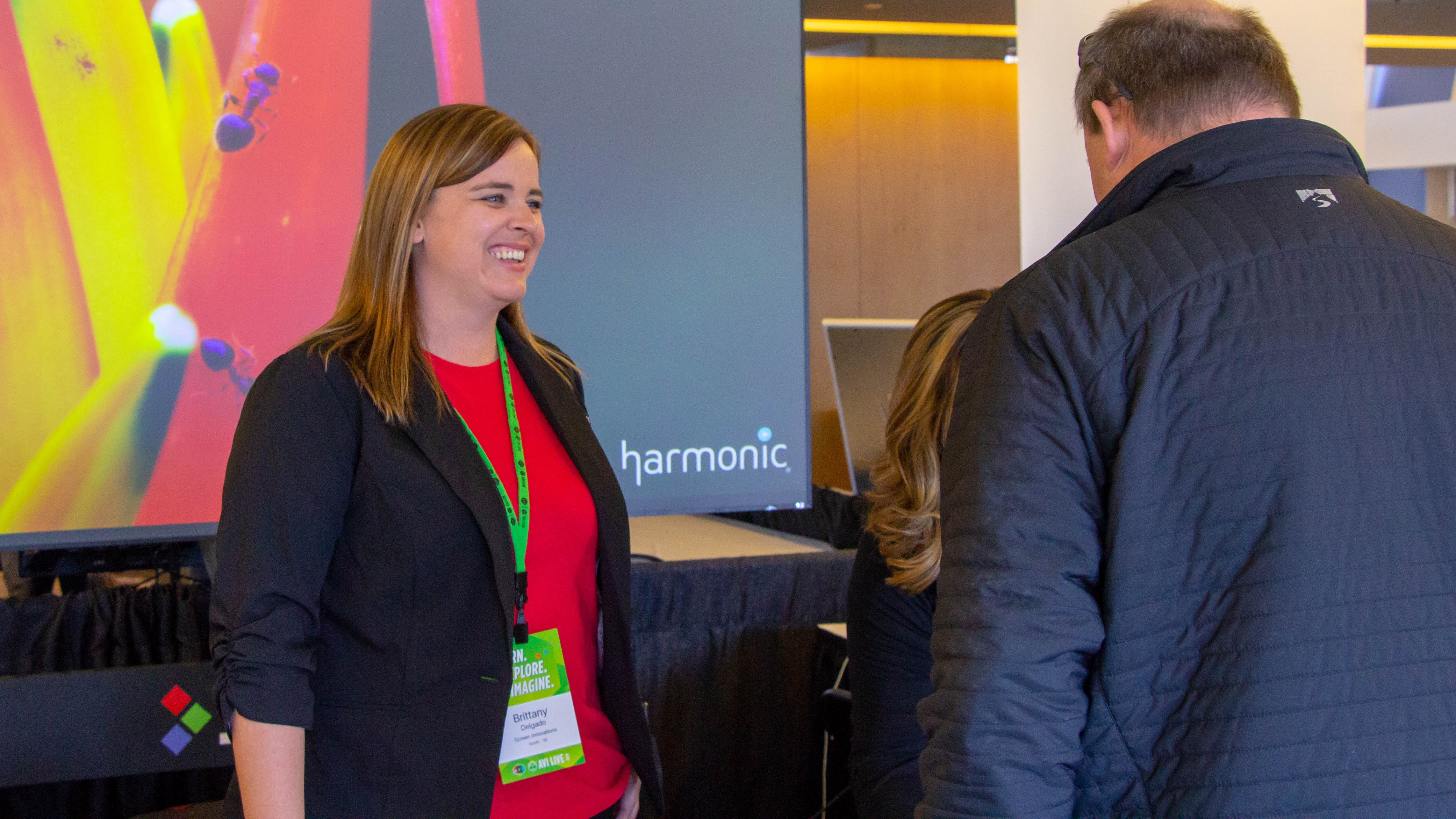 Brittany Delgado, with Screen Innovations, talks with an attendee at FORTÉ LIVE in Minneapolis. | FORTÉ Systems