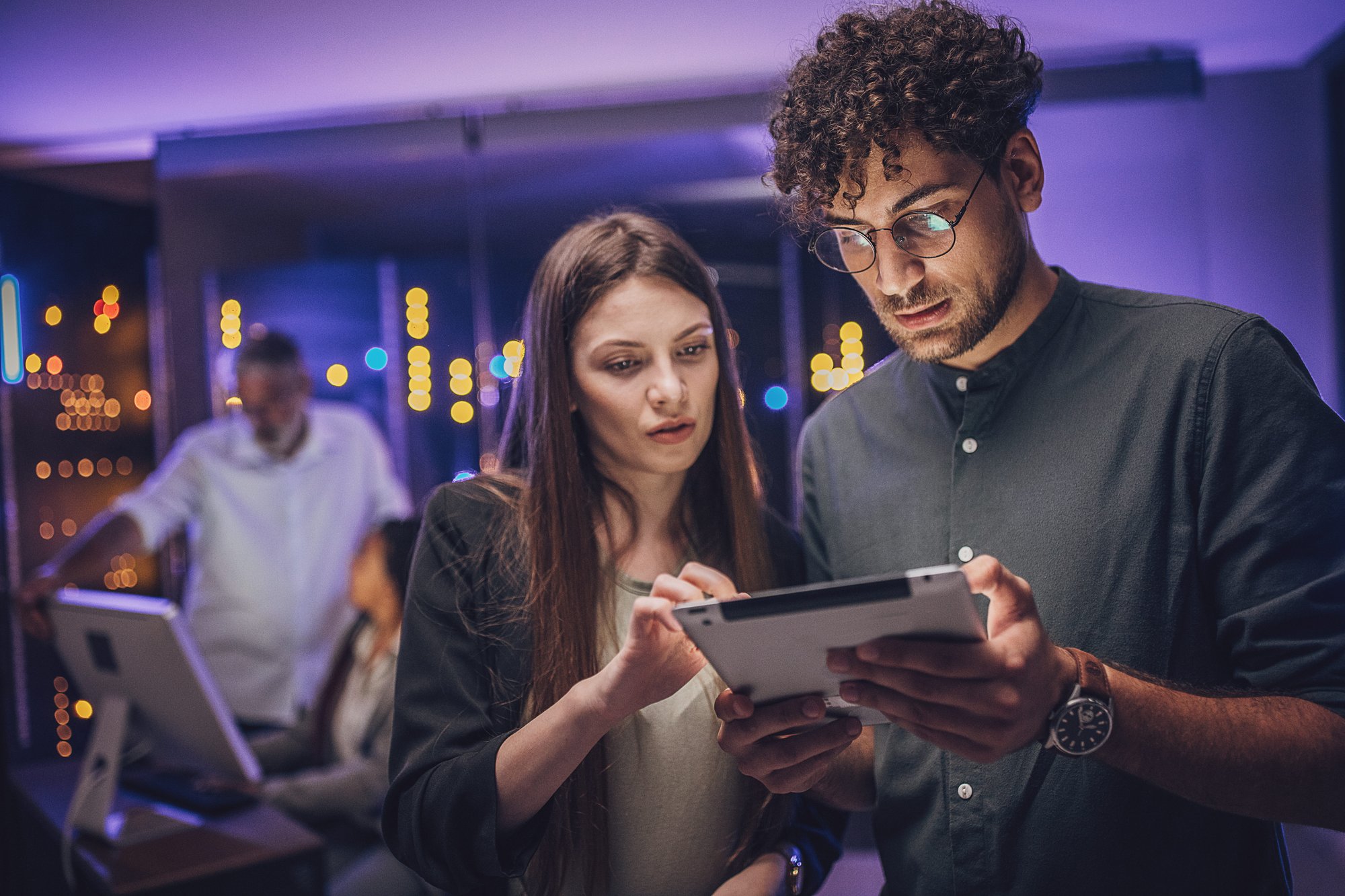 Man and woman using tablet
