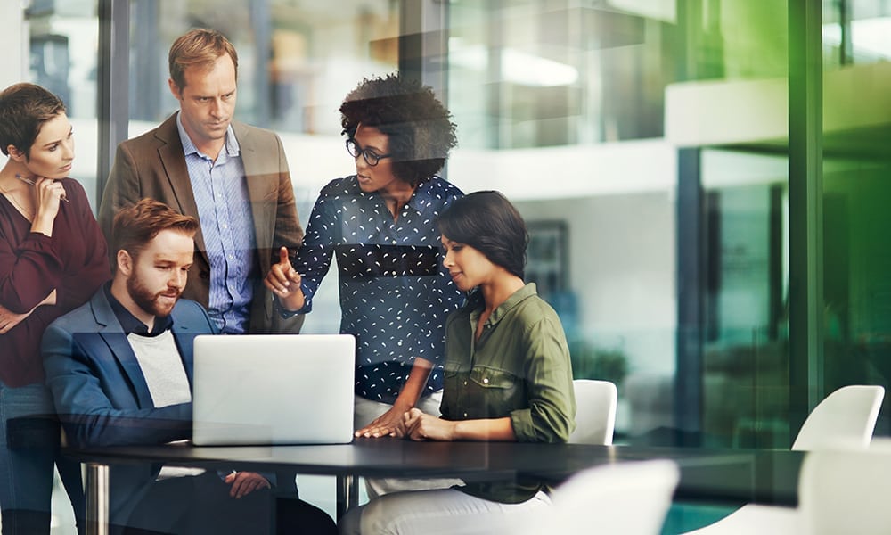 Woman-talks-with-group-of-co-workers