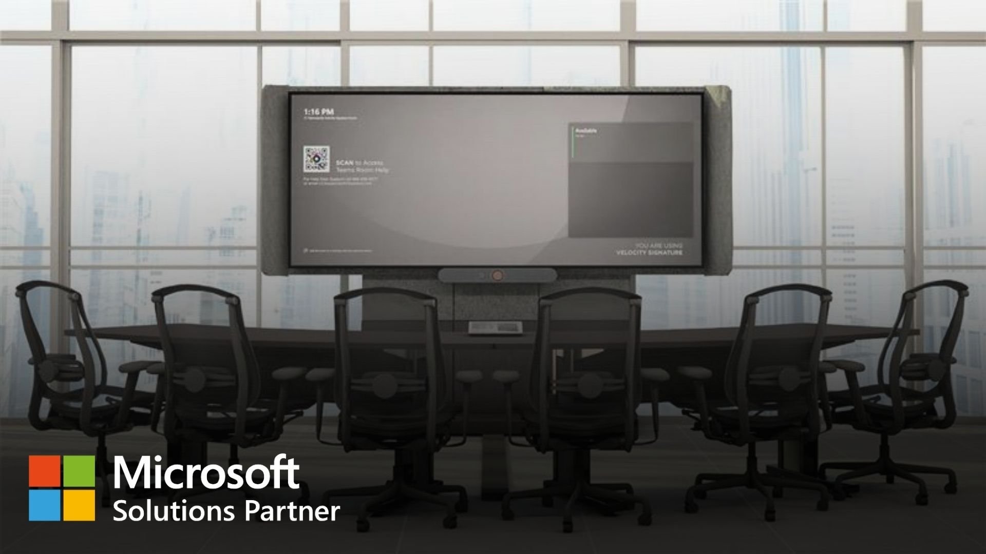 A modern conference room features a long table surrounded by office chairs facing a large wall-mounted display screen in front of floor-to-ceiling windows overlooking a cityscape.