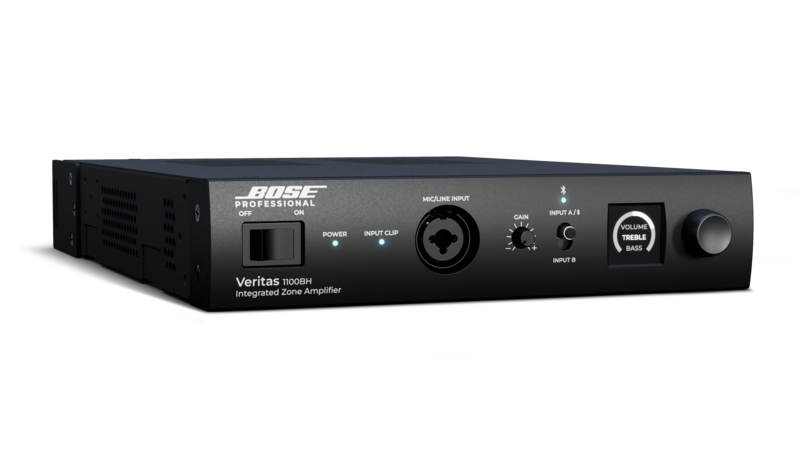 Front view of a black Bose Professional Veritas 1100BH integrated zone amplifier showing the power indicator lights, combo microphone input, gain and input controls, tone/volume knob, and a clean, minimalist front panel against a dark background.