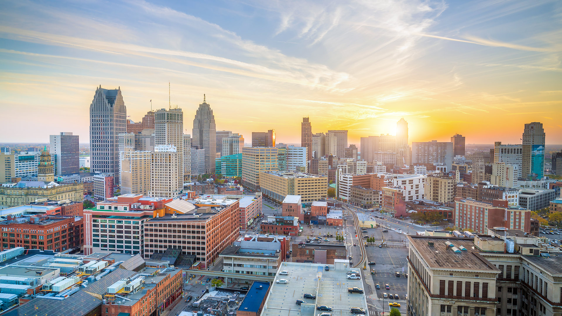 Detroit skyline at sunset with modern skyscrapers; ideal urban setting for FORTÉ's scalable AV integration solutions.